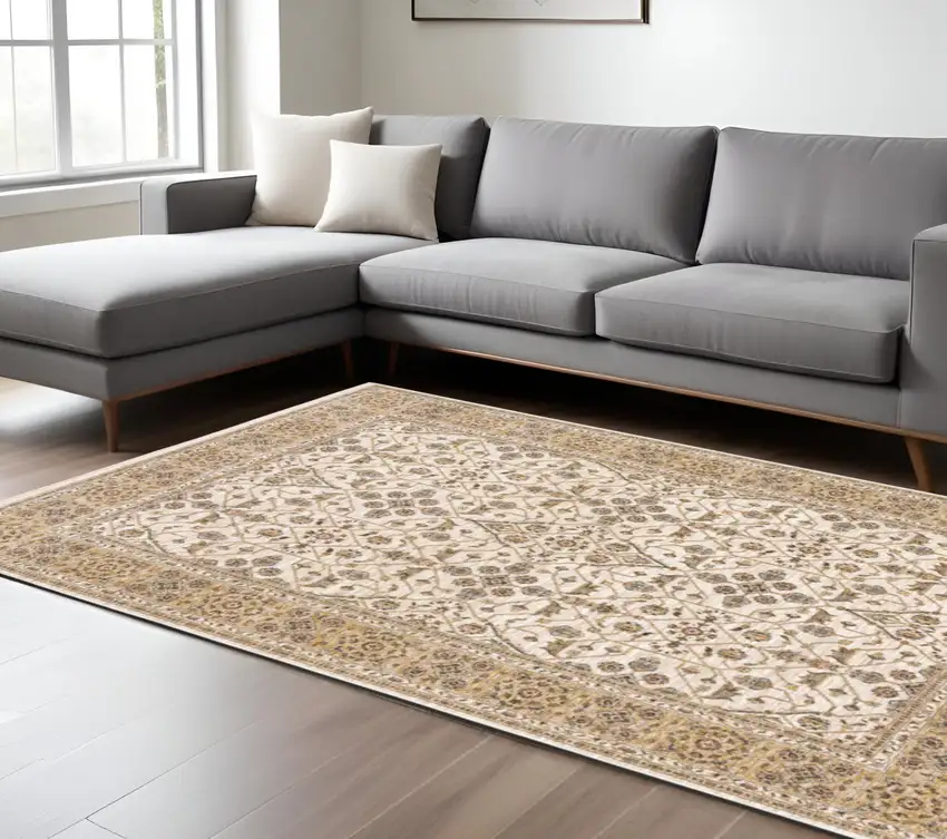 Gold and Ivory Oriental Power Loom Area Rug With Fringe Photo 1