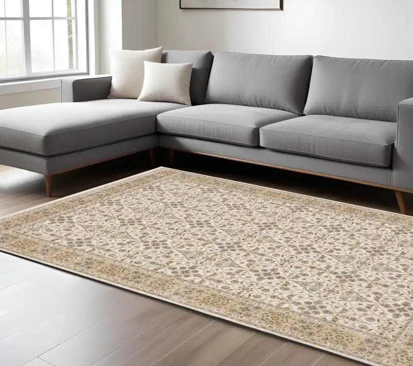 Gold and Ivory Oriental Power Loom Area Rug With Fringe Photo 1