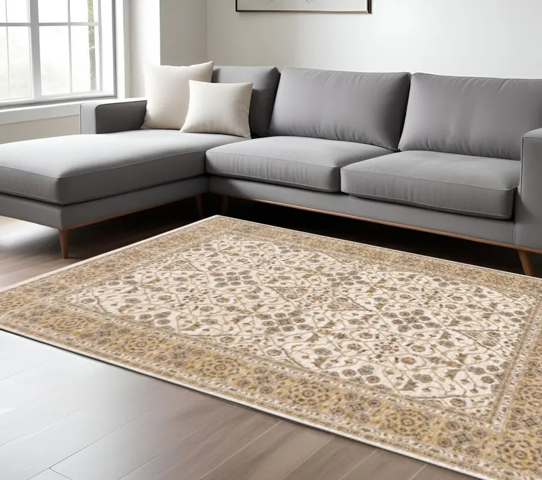 Ivory And Gold Oriental Power Loom Stain Resistant Area Rug With Fringe Photo 1