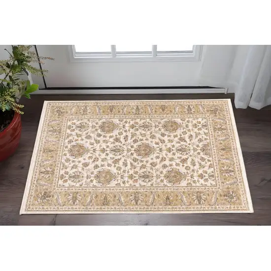 Ivory And Gold Oriental Power Loom Stain Resistant Area Rug With Fringe Photo 1