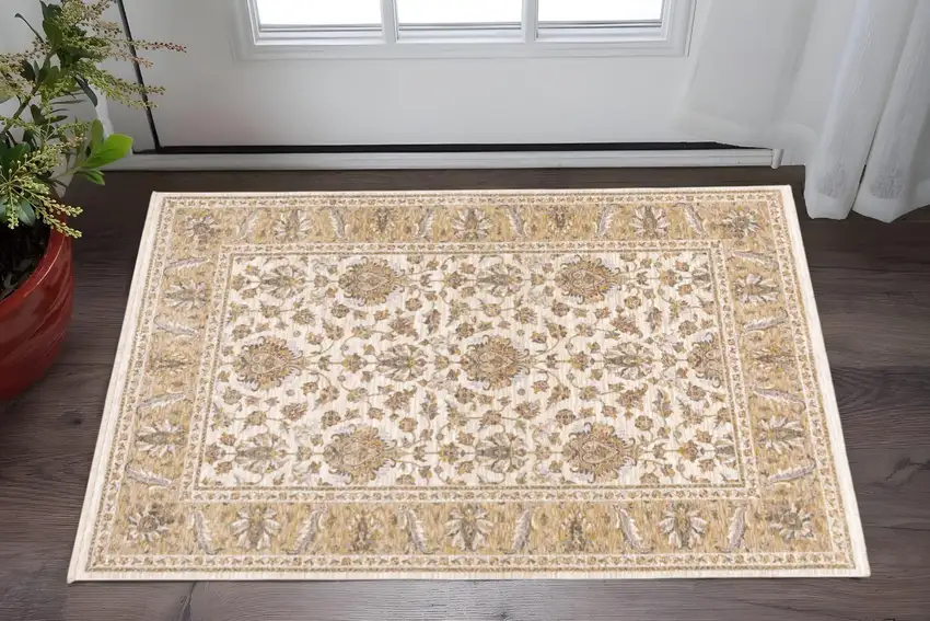 Ivory And Gold Oriental Power Loom Stain Resistant Area Rug With Fringe Photo 1