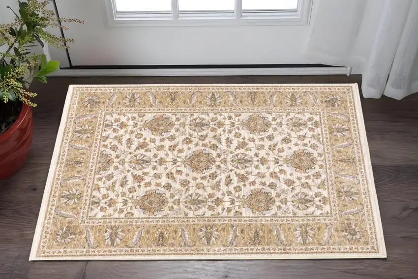 Ivory And Gold Oriental Area Rug With Fringe Photo 1