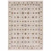 Photo of Ivory And Gold Oriental Power Loom Stain Resistant Area Rug With Fringe