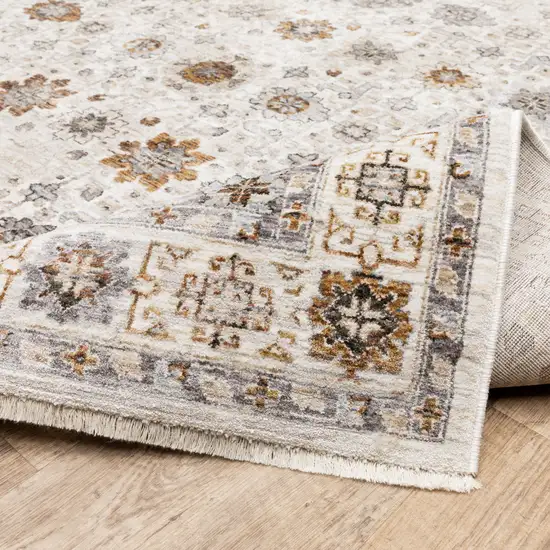 Ivory And Gold Oriental Power Loom Stain Resistant Area Rug With Fringe Photo 8