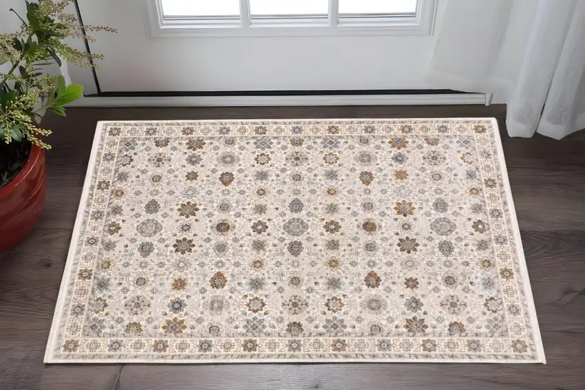Ivory And Gold Oriental Power Loom Stain Resistant Area Rug With Fringe Photo 1