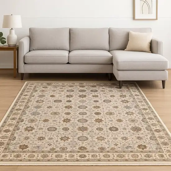 6' X 9' Ivory And Gold Oriental Power Loom Stain Resistant Area Rug With Fringe Photo 2