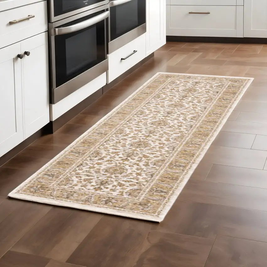 2' X 8' Ivory And Gold Oriental Power Loom Stain Resistant Runner Rug With Fringe Photo 1