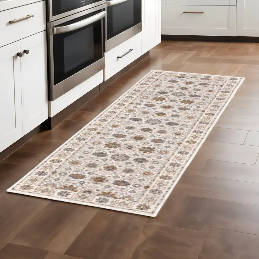 2' X 8' Ivory And Gold Oriental Power Loom Stain Resistant Runner Rug With Fringe Photo 1