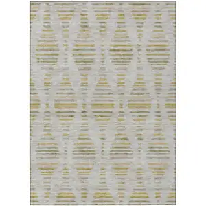 Photo of Ivory And Gold Striped Washable Indoor Outdoor Area Rug