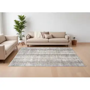 Photo of Ivory And Gray Abstract Area Rug With Fringe