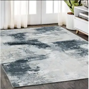 Photo of Ivory And Gray Abstract Distressed Area Rug