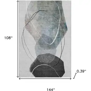 Photo of Ivory And Gray Abstract Washable Area Rug With UV Protection