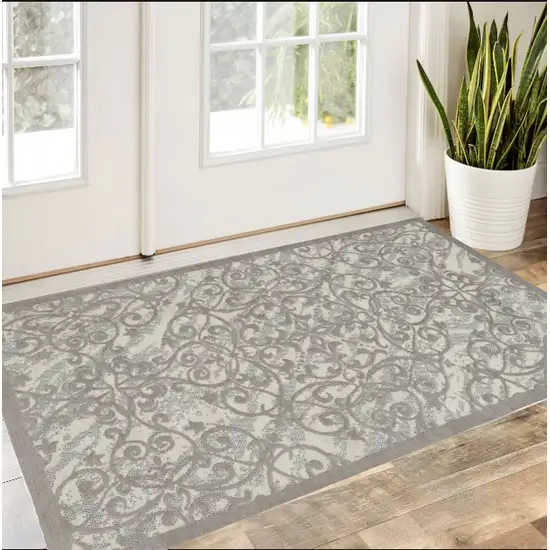 Ivory And Gray Damask Distressed Area Rug Photo 1