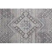 Photo of Ivory And Gray Geometric Power Loom Distressed Stain Resistant Area Rug