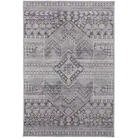 Photo of Ivory And Gray Geometric Power Loom Distressed Stain Resistant Area Rug