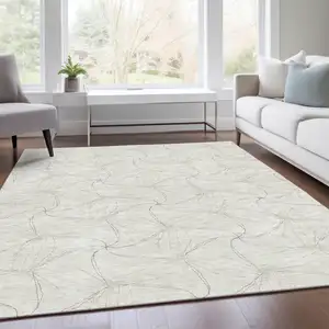 Photo of Ivory And Gray Geometric Washable Area Rug With UV Protection
