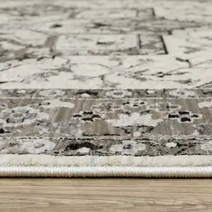 Photo of Ivory And Gray Medallion Area Rug With Fringe