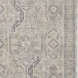 Photo of Ivory And Gray Oriental Distressed Area Rug With Fringe