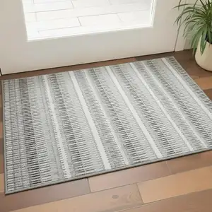 Photo of Ivory And Gray Striped Washable Area Rug With UV Protection