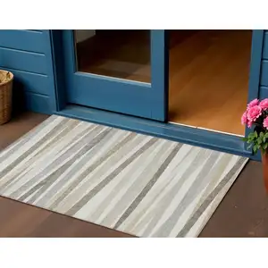 Photo of Ivory And Gray Striped Washable Indoor Outdoor Area Rug