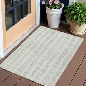 Photo of Ivory And Gray Striped Washable Indoor Outdoor Area Rug