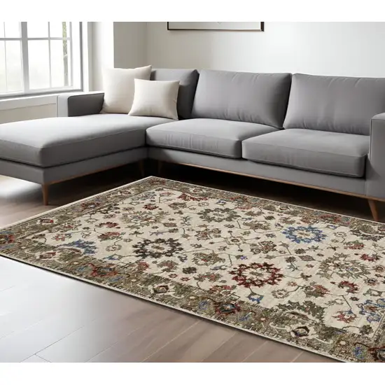 Ivory And Green Oriental Area Rug With Fringe Photo 1