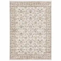 Photo of Ivory And Grey Oriental Power Loom Stain Resistant Area Rug With Fringe