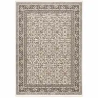 Photo of Ivory And Grey Oriental Power Loom Stain Resistant Area Rug With Fringe