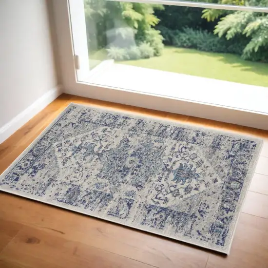 Ivory And Light Blue Floral Medallion Distressed Area Rug Photo 1