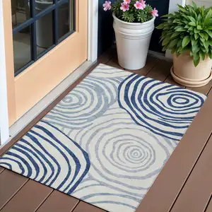 Photo of Ivory And Navy Blue Abstract Washable Indoor Outdoor Area Rug