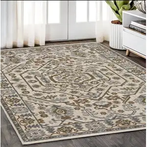 Photo of Ivory And Rust Floral Area Rug With Fringe