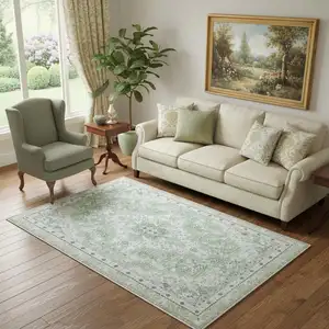 Photo of Ivory And Sage Medallion Distressed Area Rug