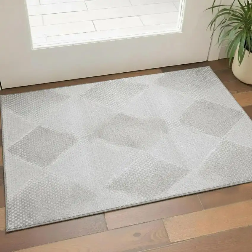 Ivory And Silver Geometric Washable Area Rug With UV Protection Photo 1