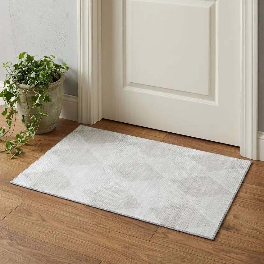 Ivory And Silver Geometric Washable Area Rug With UV Protection Photo 1