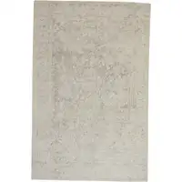 Photo of Ivory And Tan Abstract Hand Woven Area Rug
