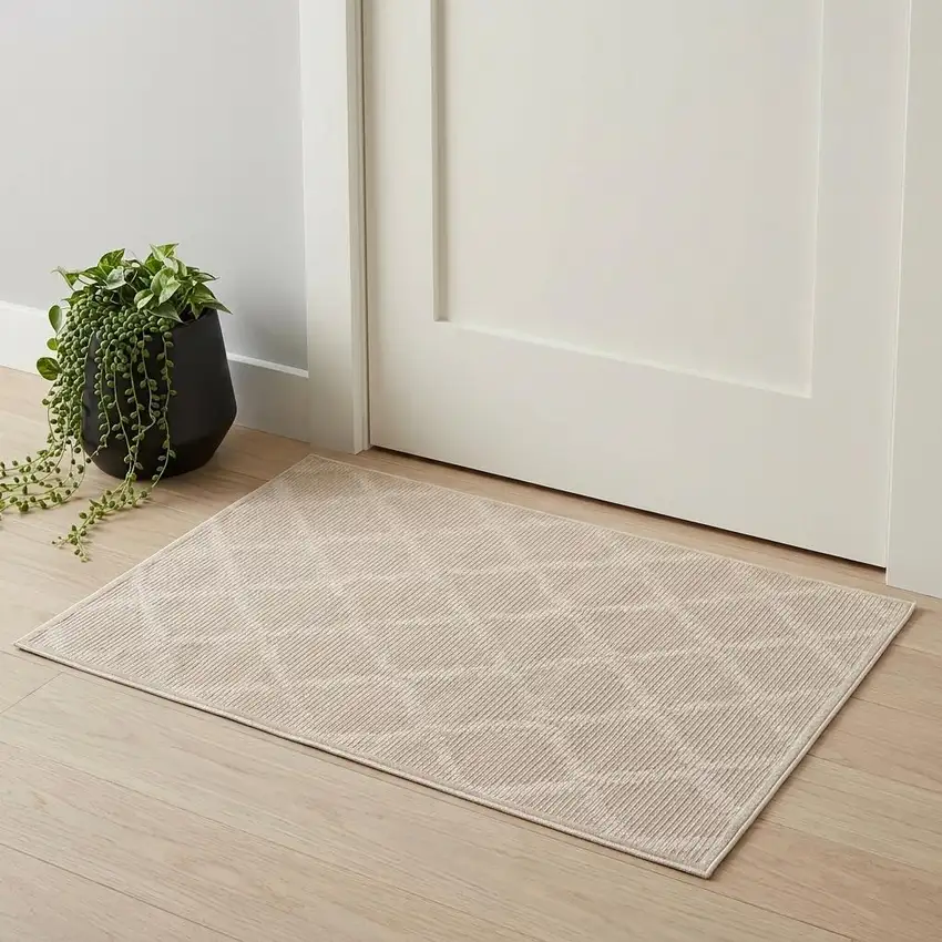 Ivory And Tan Geometric Stain Resistant Area Rug Photo 1
