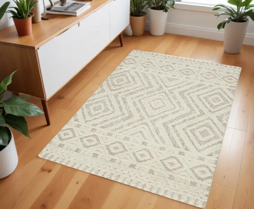 Ivory And Tan Wool Geometric Tufted Handmade Stain Resistant Area Rug Photo 1