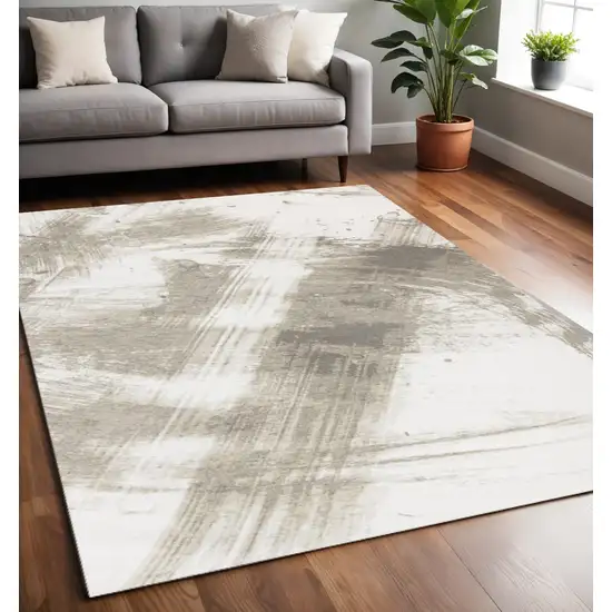 Ivory And Taupe Abstract Area Rug Photo 1