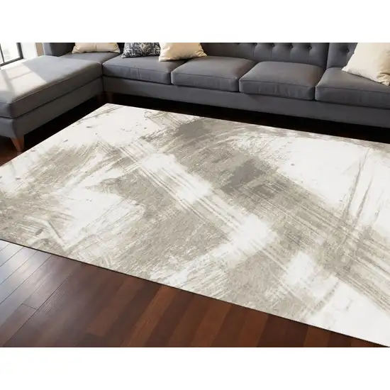 Ivory And Taupe Abstract Area Rug Photo 1