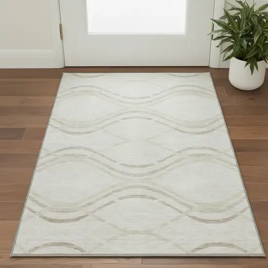 Ivory And Taupe Abstract Washable Area Rug With UV Protection Photo 2