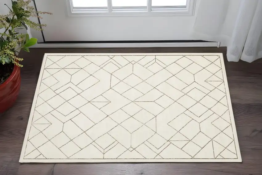 Ivory And Taupe Geometric Area Rug Photo 1