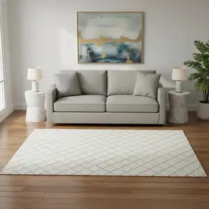 Photo of Ivory And Taupe Geometric Washable Area Rug With UV Protection