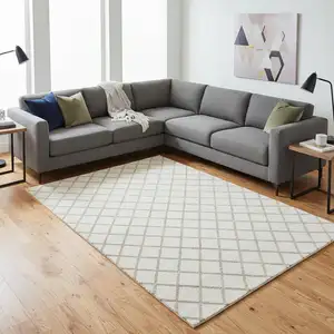 Photo of Ivory And Taupe Geometric Washable Area Rug With UV Protection