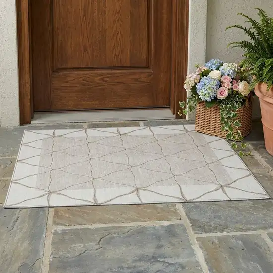 Ivory And Taupe Geometric Washable Indoor Outdoor Area Rug Photo 1