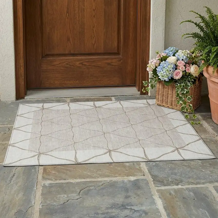 Ivory And Taupe Geometric Washable Indoor Outdoor Area Rug Photo 1