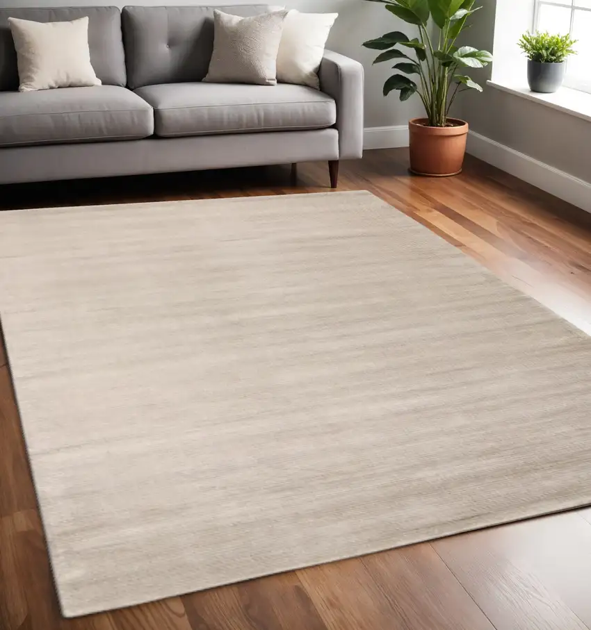 Ivory And Tan Hand Woven Distressed Area Rug Photo 1