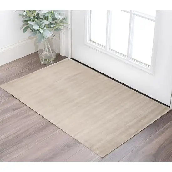 Ivory And Taupe Hand Woven Distressed Area Rug Photo 1