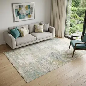 Photo of Ivory And Teal Abstract Area Rug
