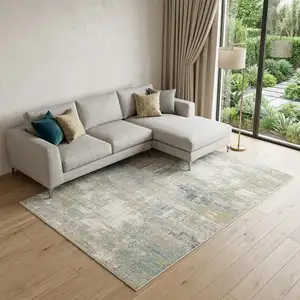 Photo of Ivory And Teal Abstract Area Rug