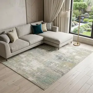 Photo of Ivory And Teal Abstract Area Rug